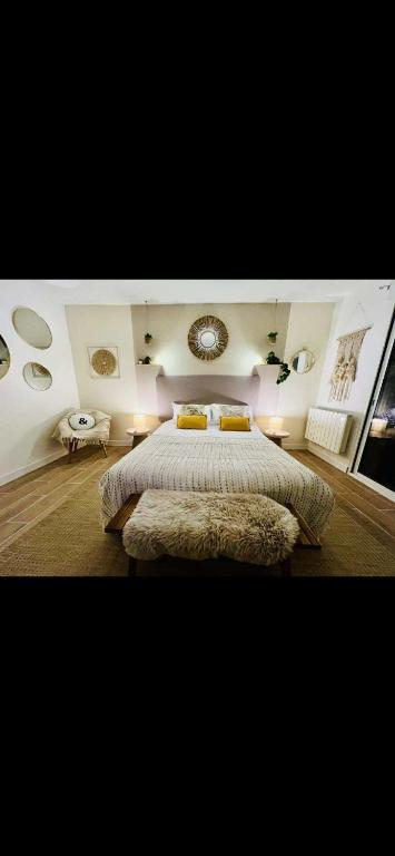 a bedroom with a large bed in a room at Le côte d opale bohème plage in Calais