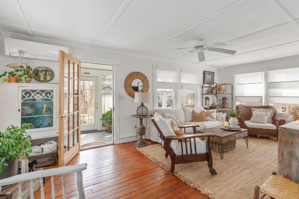 a living room with a couch and a table at Cape Cod Bungalow Walk to Beach Firepit in Yarmouth