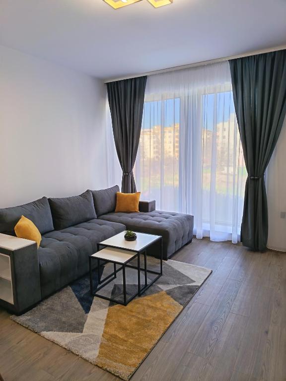 a living room with a couch and a table at Boutique apartment 4 in Plovdiv