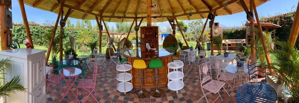a gazebo with a table set up for a wedding at Casa Colibries Cotacachi EC in Cotacachi