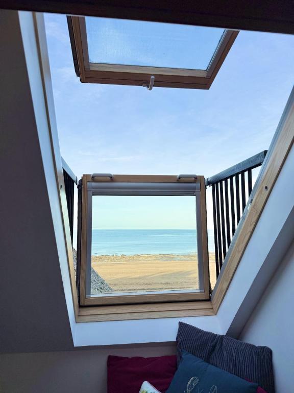 a view of the ocean from a room with a window at Coastal Nest in Margate