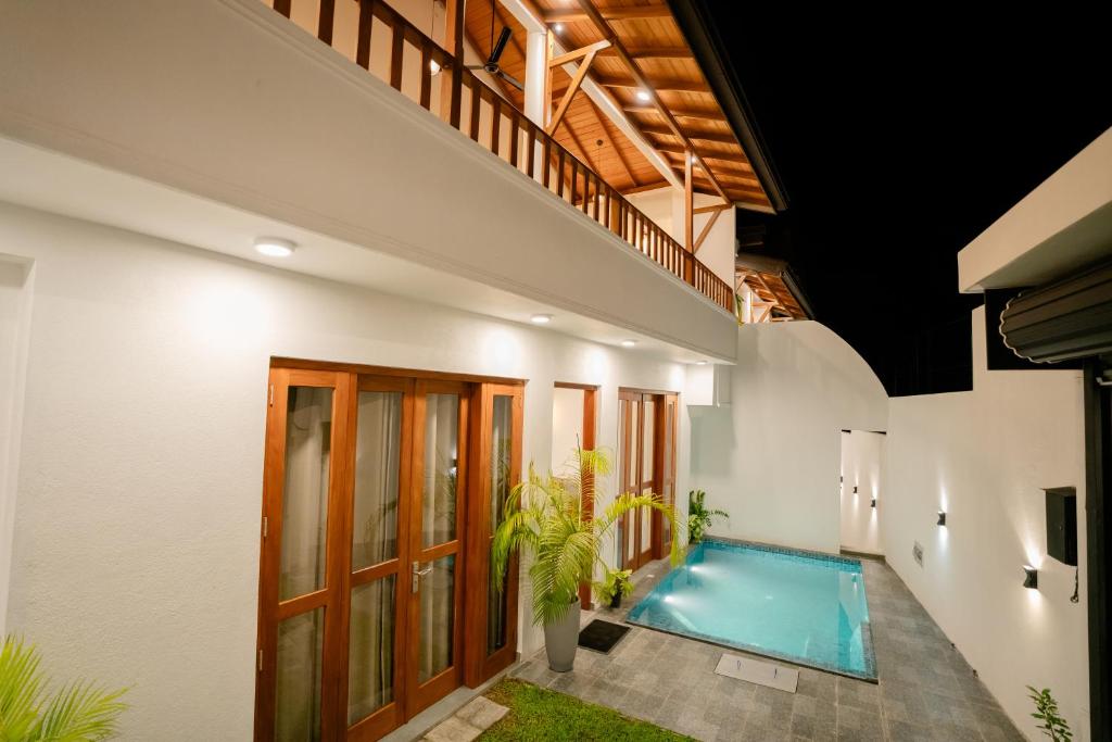 a swimming pool in the middle of a house at Villa Balcony Bliss in Unawatuna