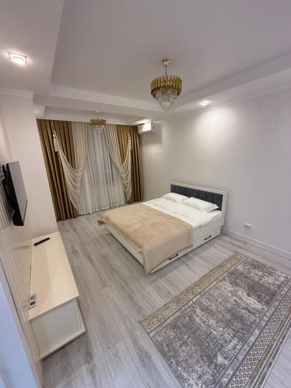 Una cama o camas en una habitación de STA Apart