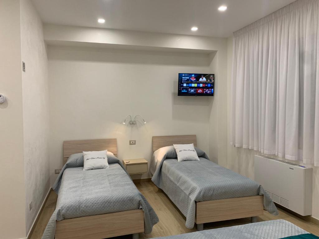 Ένα ή περισσότερα κρεβάτια σε δωμάτιο στο b&b NEAR AIRPORT LAMEZIA