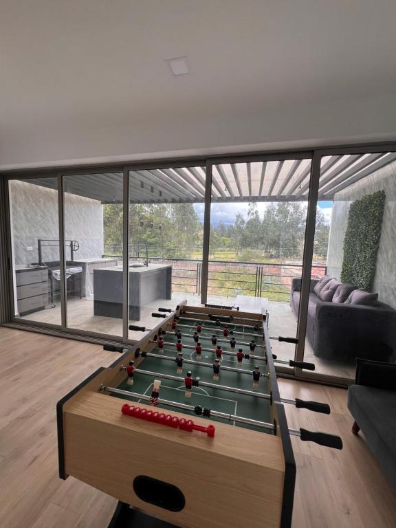 Sala de juegos en Tu refugio de lujo en Cuenca!