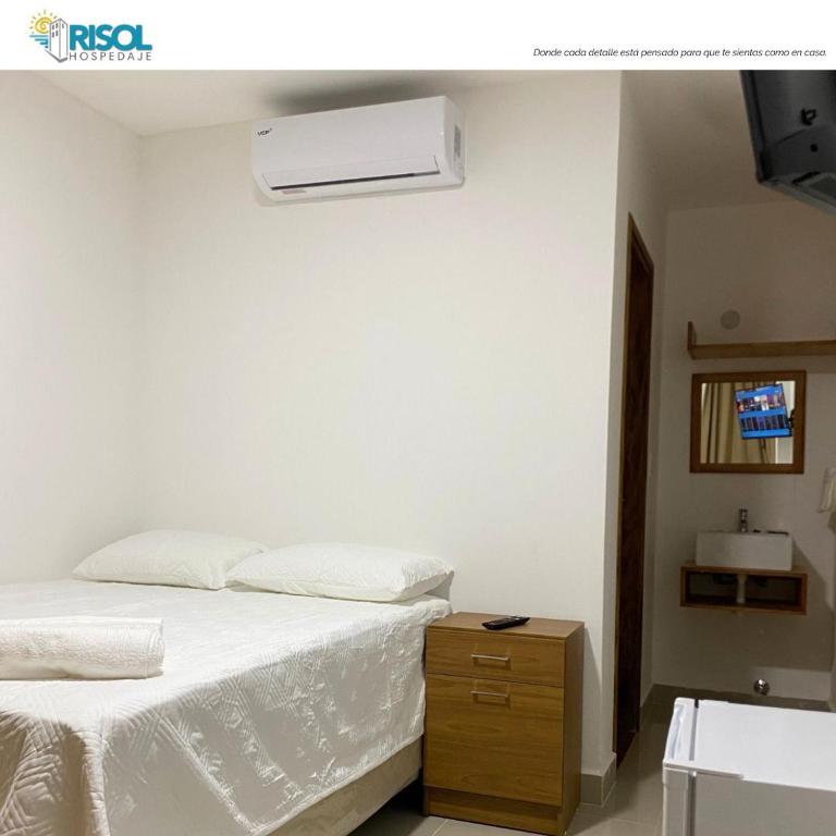 En eller flere senge i et værelse på Risol