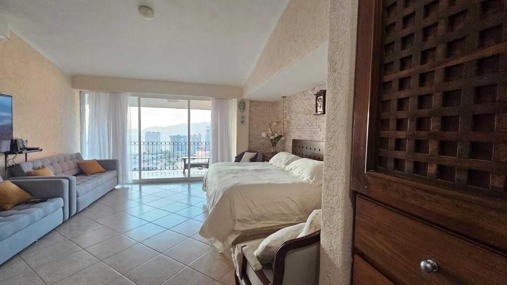 En eller flere senge i et værelse på Casa las Palmas