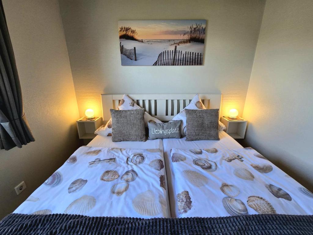 En eller flere senge i et værelse på Ferienhaus Küstenzauber Simonsberg Nordsee Meer Husum