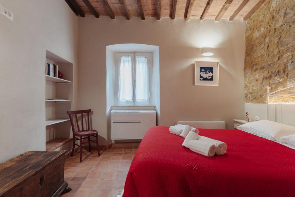 Una cama o camas en una habitación de L'Amorino di Raffaella