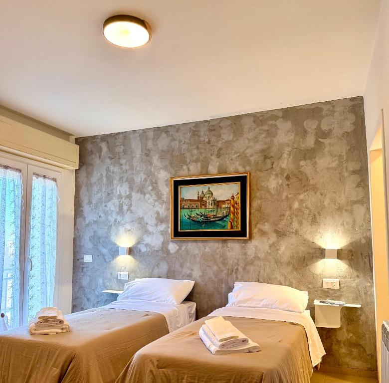 Ένα ή περισσότερα κρεβάτια σε δωμάτιο στο B&B Il GLICINE