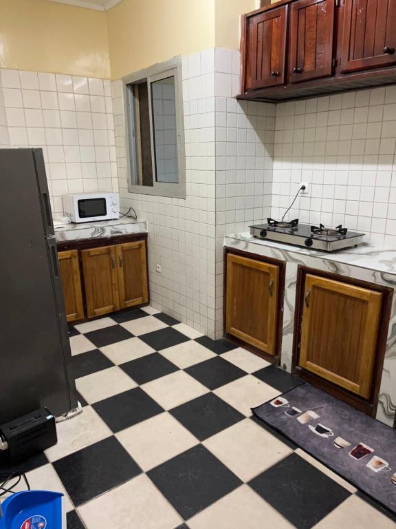 Kuchyň nebo kuchyňský kout v ubytování Residence Ngouandjo