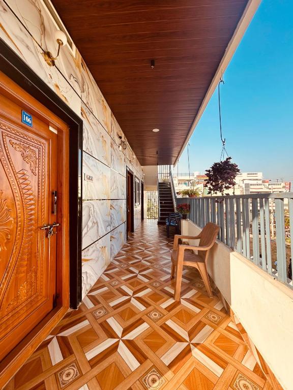 Outdoor seating and parking area at Hemanth Heritage Hotel, Kamalapur