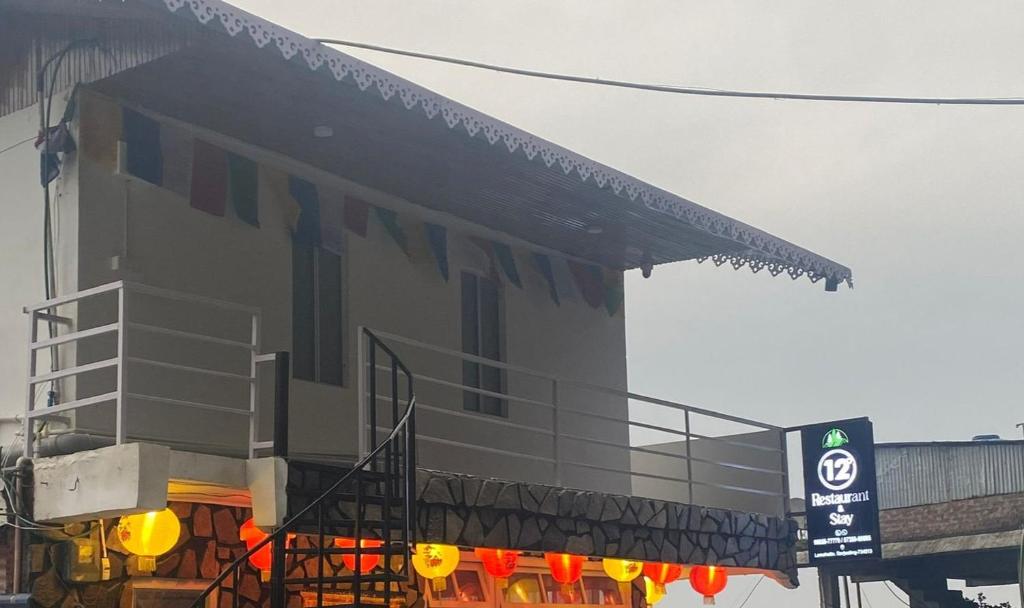 a building with a sign in front of it at 12 Degree in Takdāh