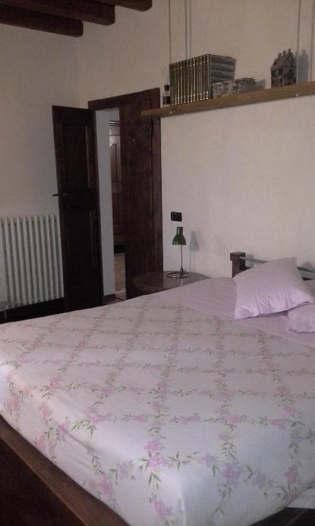 Postel nebo postele na pokoji v ubytování B&B Ai Tre Confini