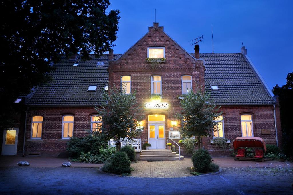 a brick house with a sign on the front of it at Land-gut-Hotel Allerhof in Frankenfeld