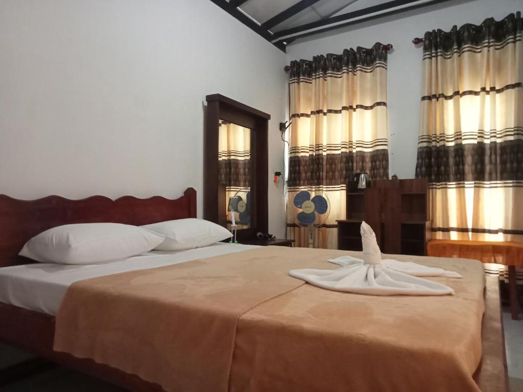 Ένα ή περισσότερα κρεβάτια σε δωμάτιο στο Waruna Relax Homestay