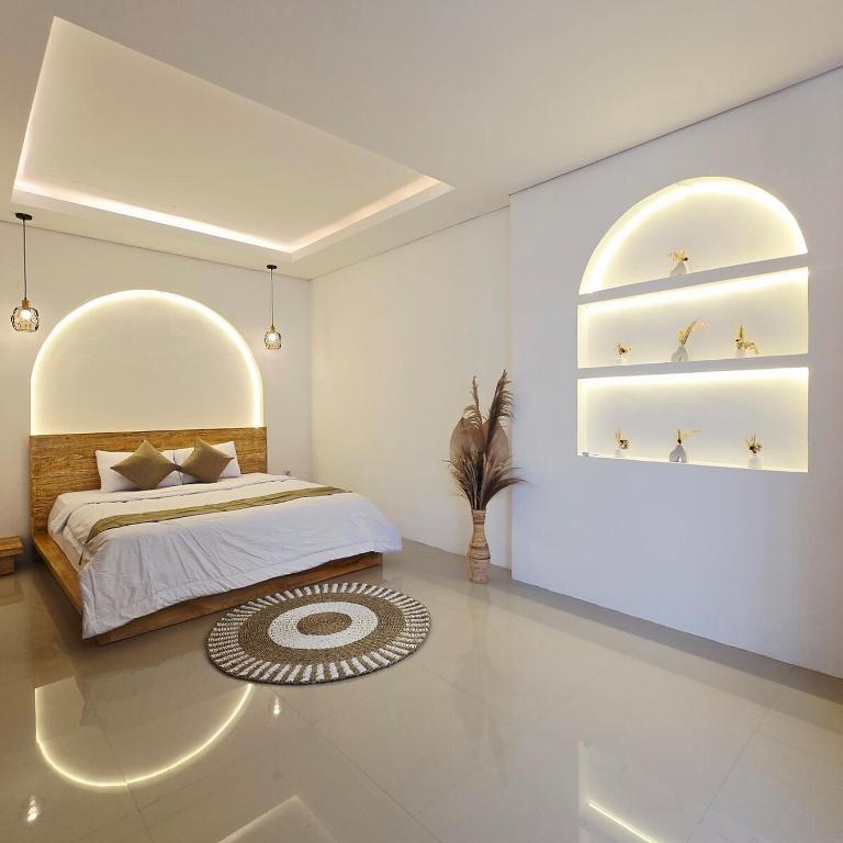 a bedroom with a bed and two shelves with stars at 3 Bedroom Private Pool Villa in Mengwi Kapal in Kapal