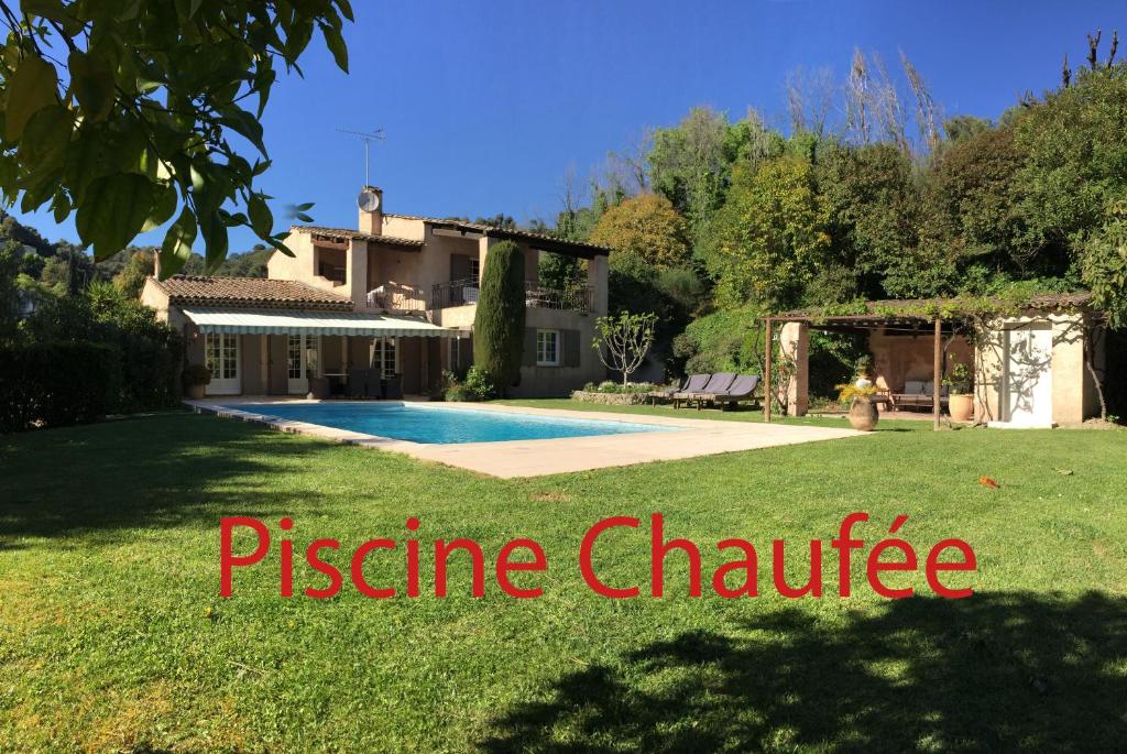 a house with a swimming pool in a yard at Villa Saint Paul in Saint-Paul-de-Vence