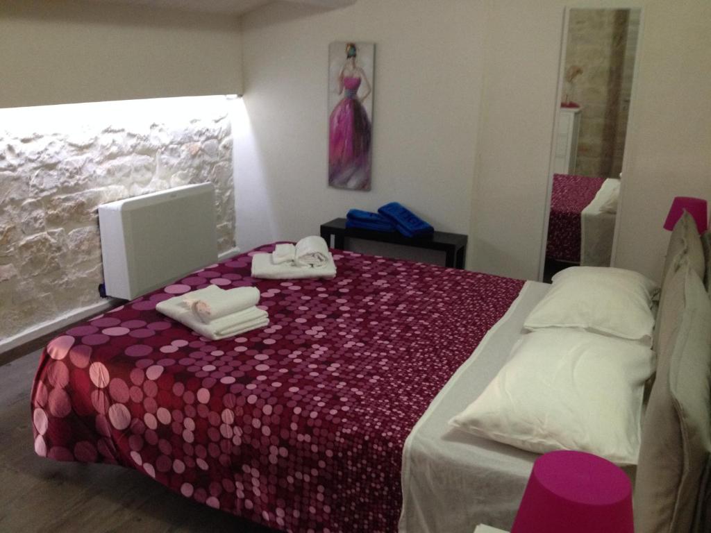 Łóżko lub łóżka w pokoju w obiekcie Villa Antica Aia Relax