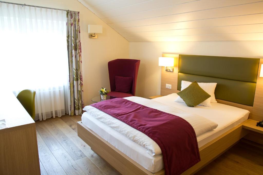 Postel nebo postele na pokoji v ubytování Hotel Buchserhof