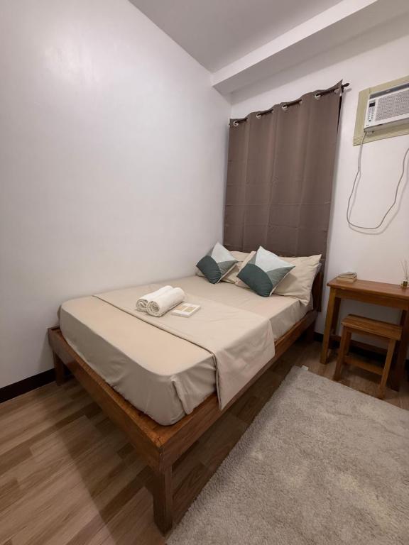 En eller flere senge i et værelse på Isla Pahulay Apartments