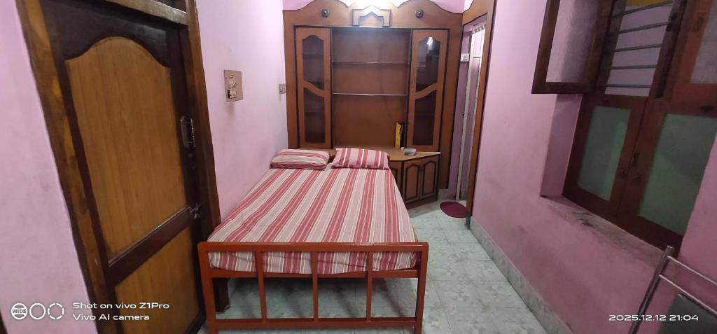 Postel nebo postele na pokoji v ubytování Shree chendur homestay