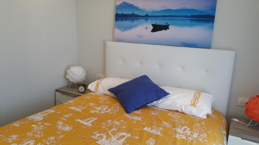Ένα ή περισσότερα κρεβάτια σε δωμάτιο στο Apartamento Castrelos