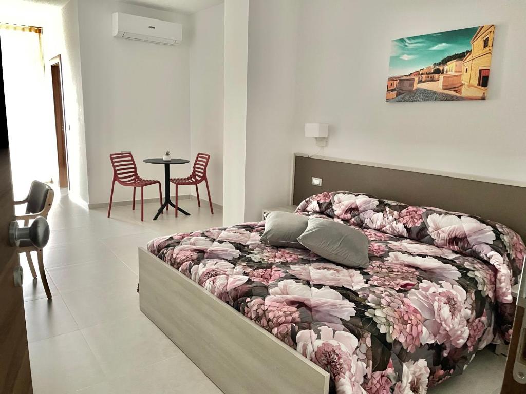 Кровать или кровати в номере La Candela Affittacamere