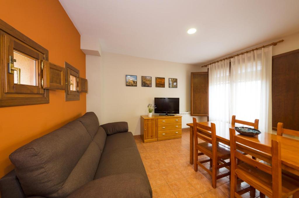 Una televisión o centro de entretenimiento en Apartamentos Casa Aurelia