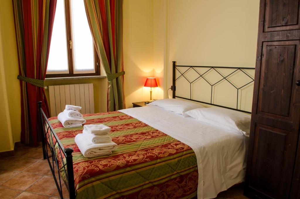 Postel nebo postele na pokoji v ubytování Hotel Oberje Dla Viere