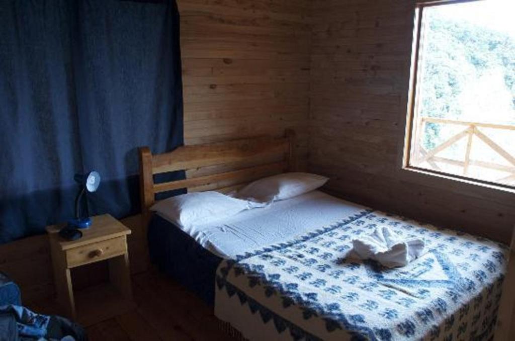 Postel nebo postele na pokoji v ubytování Quetzal Valley Cabins