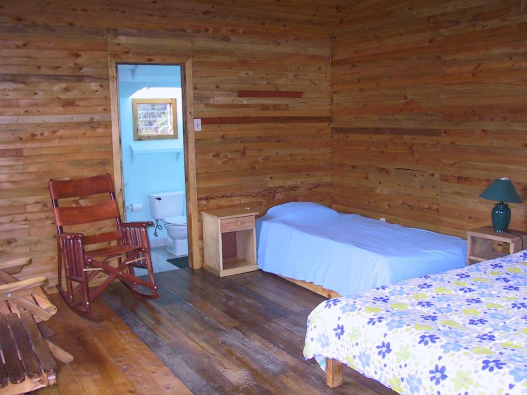 Postel nebo postele na pokoji v ubytování Quetzal Valley Cabins