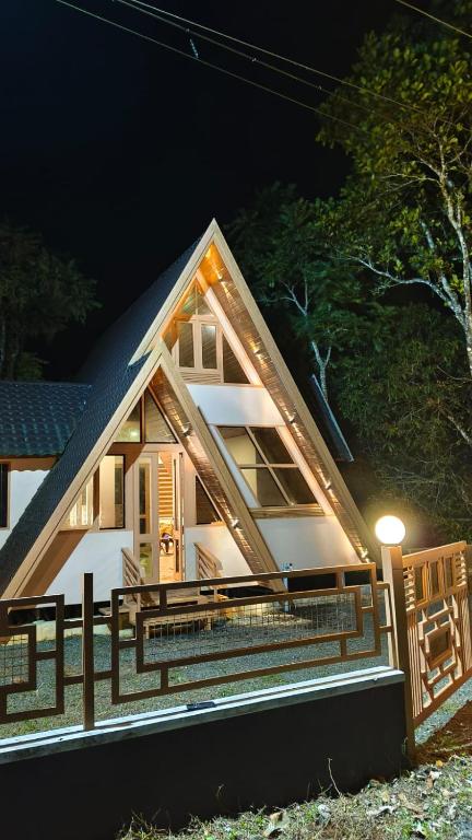 a house is lit up at night at Cloud Peak in Vagamon