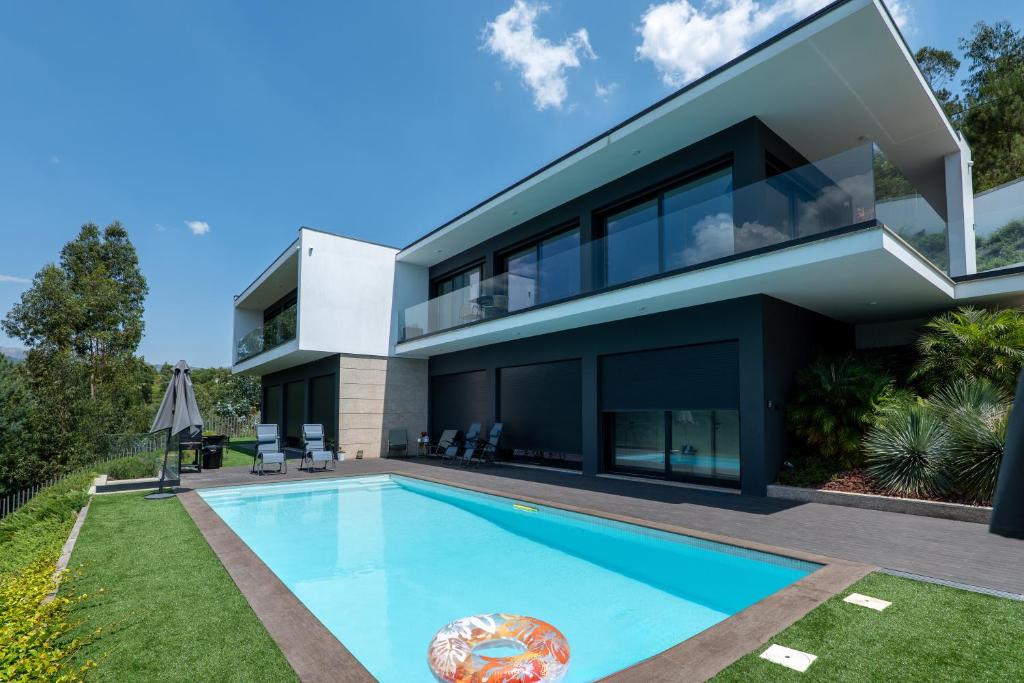 an image of a house with a swimming pool at Gerês Paradise in Geres