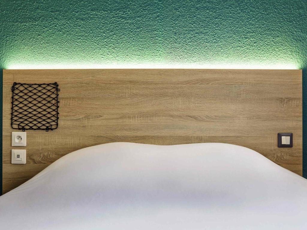 Postel nebo postele na pokoji v ubytování hotelF1 Mulhouse Centre Ouest