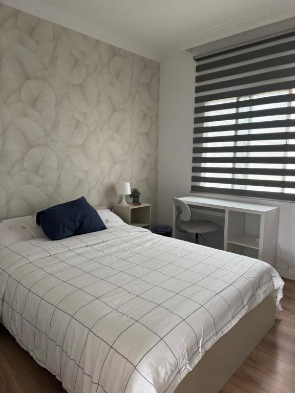 Ένα ή περισσότερα κρεβάτια σε δωμάτιο στο Room Mayi GC