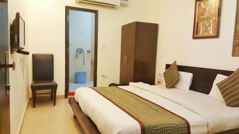 Ένα ή περισσότερα κρεβάτια σε δωμάτιο στο HOTEL TWB Palace