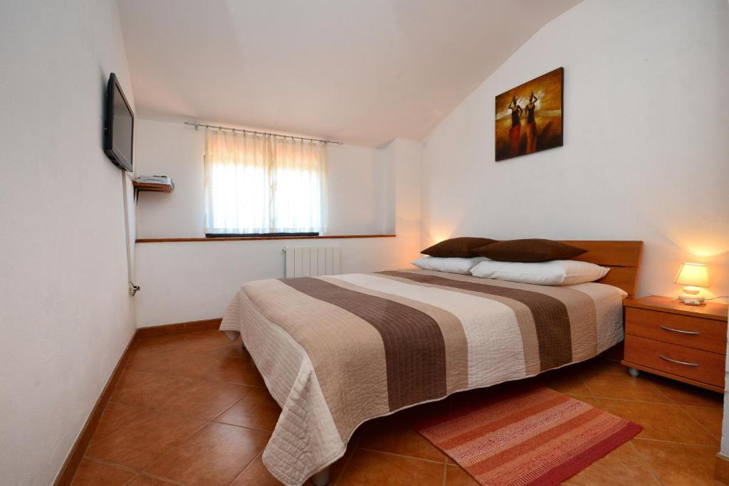 Postel nebo postele na pokoji v ubytování Apartment LILI