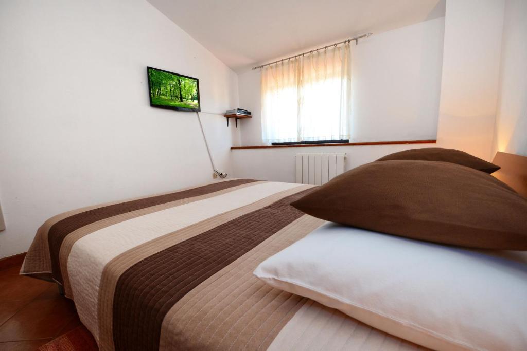 Postel nebo postele na pokoji v ubytování Apartment LILI