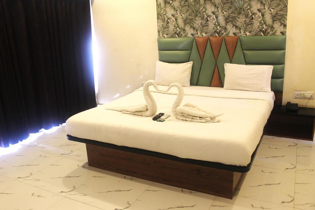 Ένα ή περισσότερα κρεβάτια σε δωμάτιο στο Hotel Planet Four