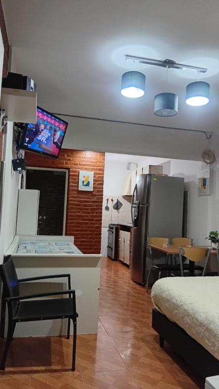 a room with a kitchen and a living room at Departamentos tini in La Punta