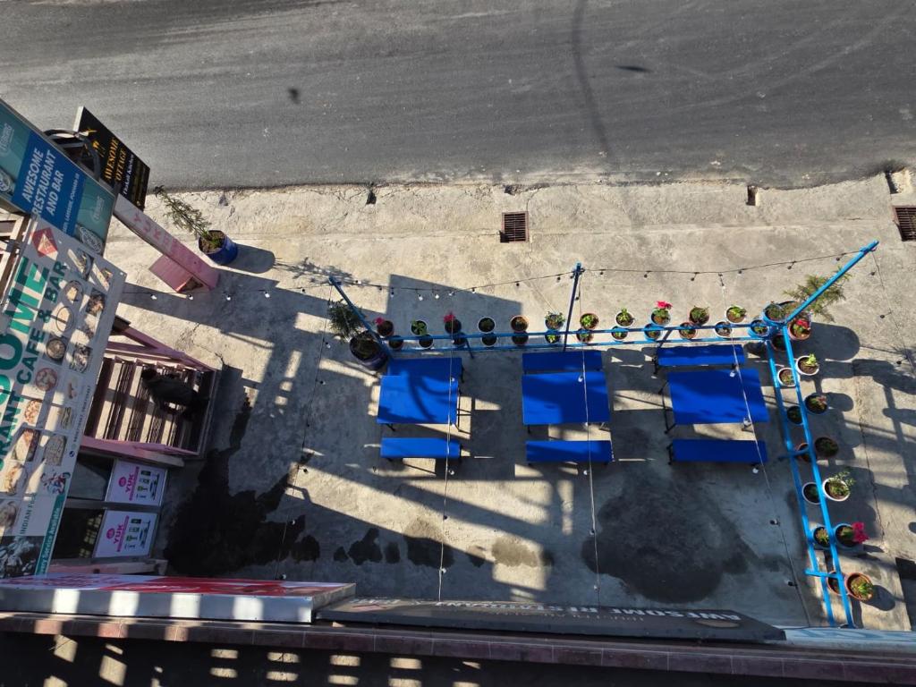 an overhead view of a street with a group of blue chairs at Awesome Cottage in Kāskī
