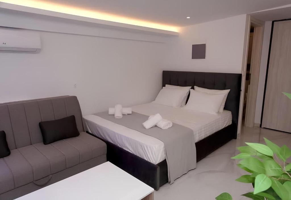 Кровать или кровати в номере IFI Apartments