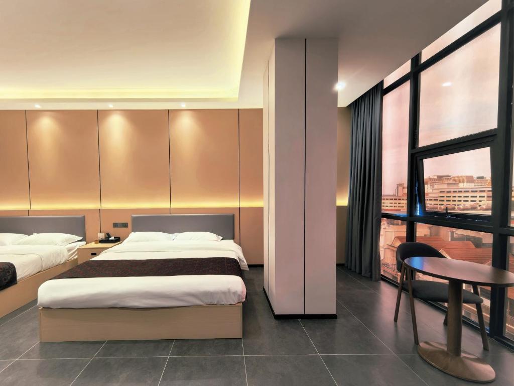 Ένα ή περισσότερα κρεβάτια σε δωμάτιο στο 游子酒店