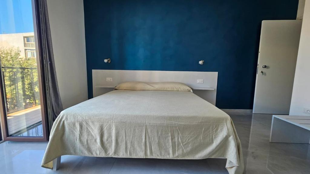 En eller flere senge i et værelse på Scalea Sunrise