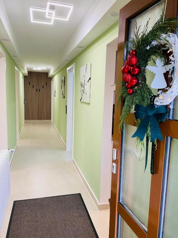 a hallway with a christmas wreath on the wall at Kandelblick in Waldkirch