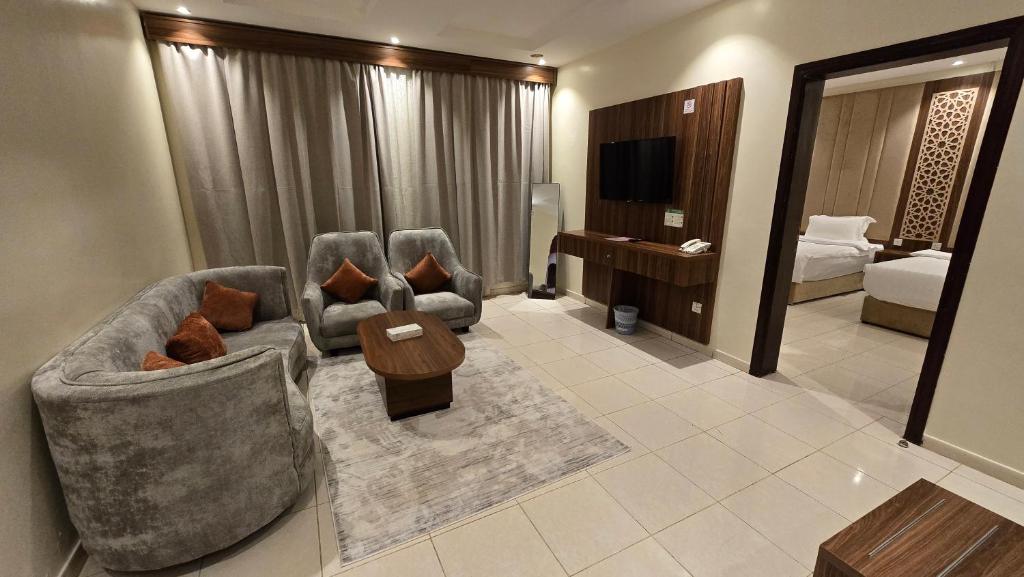 En eller flere senge i et værelse på فندق أبراج التاج