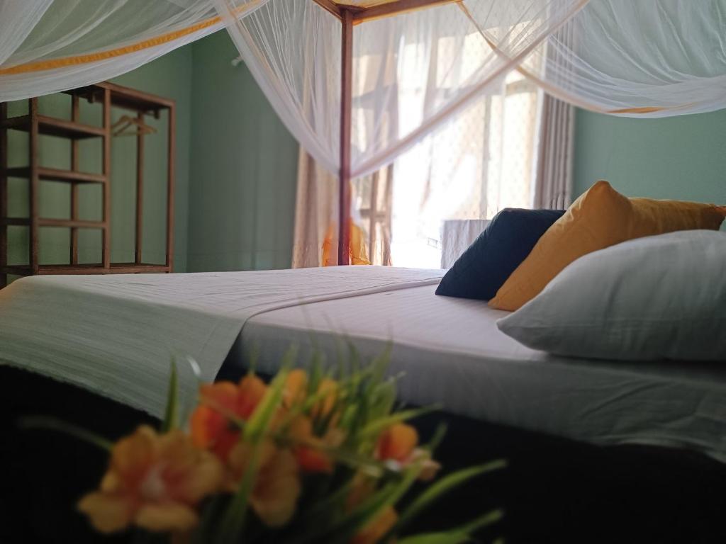 Postel nebo postele na pokoji v ubytování B&B G&H home Zanzibar