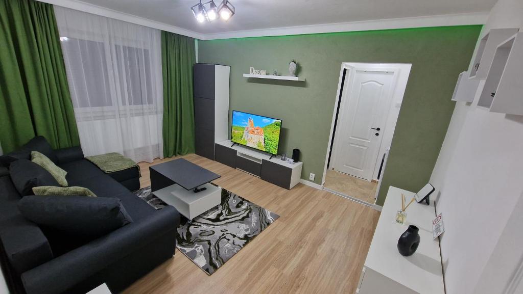 Et tv og/eller underholdning på Cozy green apartament