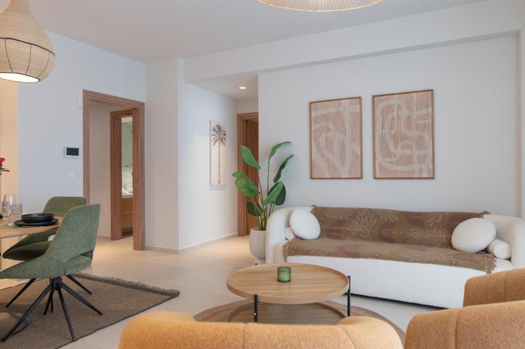 a living room with a couch and a table at Aurelia Residence in Kos